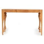 A contemporary console table designed by John Reeves for Heal's, made in oak