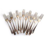 A set of 13 silver Old English pattern desert forks, the underside of the terminals crested, by