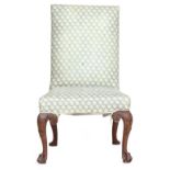 A George I carved walnut side chair with upholstered back and stuffover seat on cabriole legs,