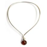 A Danish sterling silver necklace with an amber centrepiece, marked with the maker NE FROM, 925S,