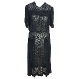 Black silk devore 1930s dress with smocking detail across the chest and on false patch pockets to