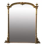 A Victorian gilt framed overmantle mirror flanked by barley twist columns above scrolling base,