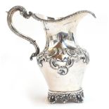 A silver milk jug, marker's mark W S over H S, London 1922, scrolling acanthus handle, the body