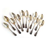 A set of 12 silver fiddle and thread pattern desert spoons, by William Eley, William Fearn & William