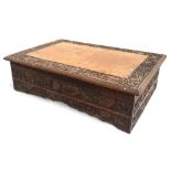 A 19th century Chinese hardwood travelling desk for export, the top and sides profusely carved