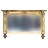 An early Victorian giltwood framed rectangular overmantel mirror, with moulded acanthus half round
