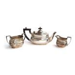 A three piece silver tea set by William Hutton & Sons Ltd, Sheffield 1936, of oblong form, the