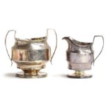 A George III two handled and footed sugar bowl and milk jug engraved and monogrammed JMH, Robert