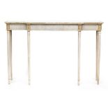 A 20th century white painted and parcel gilt break front side table, in the neoclassical style, on