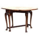 A late 19th century shaped oval gateleg table, on cabriole legs, united by stretchers Provenance: