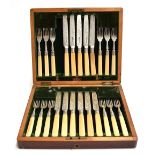 A cased set of twelve silver and bone handled fruit knives and forks, one knife missing, R F