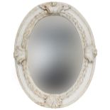 An 18th century Italian white painted oval mirror, the later plate within a concave and laurel frame
