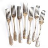 A set of seven George IV silver fiddle pattern table forks, crested, by William Eley & William