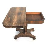 A Georgian rosewood swivel top card table on octagonal pedestal and shaped base