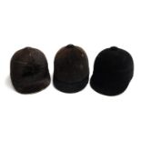 Three vintage black hunting caps, two retailed by Caldine, size 7 1/8 and 7 1/4, one by Moss Bros