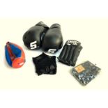 A pair of black 'Snap On' boxing gloves, together with three pairs of black boxing bag gloves and