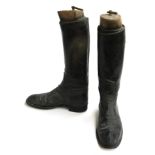 A pair of gent's black hunting boots, some patching, approximately size 8.5, with wooden trees