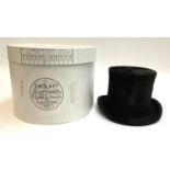 A Mortlock & Son black silk top hat; together with a Lock & Co. top hat box, size 7 1/8