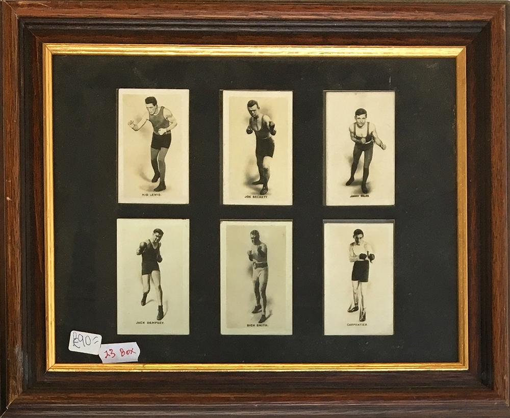 A framed set of 6 'Monarchs of the Ring' cigarette cards, depicting various boxers