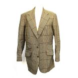 James & James Ltd., Old Burlington Street W1, 1976, a single breasted tweed suit with three buttons,