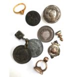 A number of hunting related curios, including two fobs, one with running fox set in yellow metal,