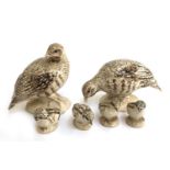 A group of ceramic sculptures of a two adult partridges and four chicks
