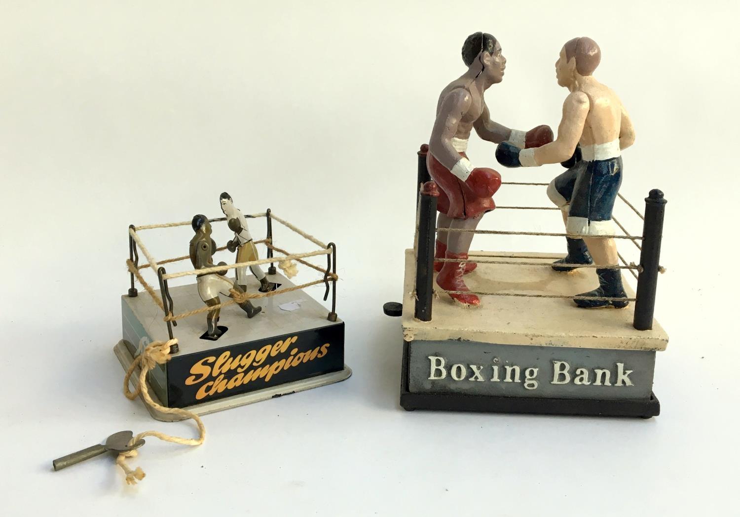 Boxing interest, a cast iron novelty 'Boxing Bank', 21cmH; together with 'Slugger Champions' wind up