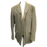 A gents three piece single breasted tweed suit, two pairs of trousers each with braces, with