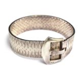 A silver (marked 835) flexible bracelet with diamond effect links and a buckle fastening, makers