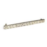 Diamond bar brooch, unmarked but tests as platinum, 15 old cut diamonds, gross weight 4g, approx 1.