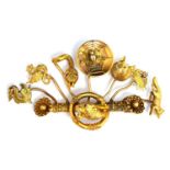 An unusual yellow metal and gold brooch, the original bar features a lion with ruby eyes to which