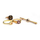 An 18ct gold ring set with central diamond flanked by 6 rubies, size P.5, weight 4.1g; 21ct gold