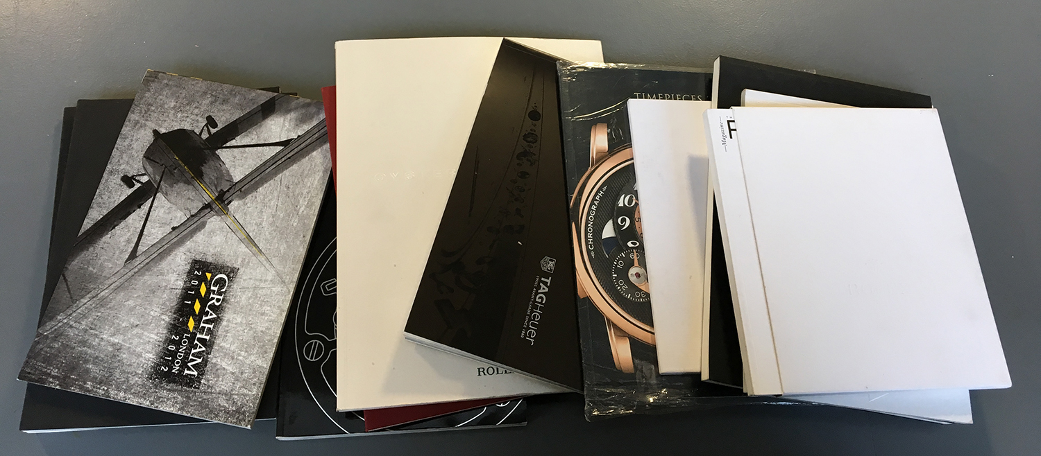 A collection of 13 watch catalogues, from various makers including Rolex, Omega, Bell & Ross, Tag