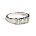 An 18ct white gold diamond ring featuring three round cut diamonds, approx. 60 carat, gross weight