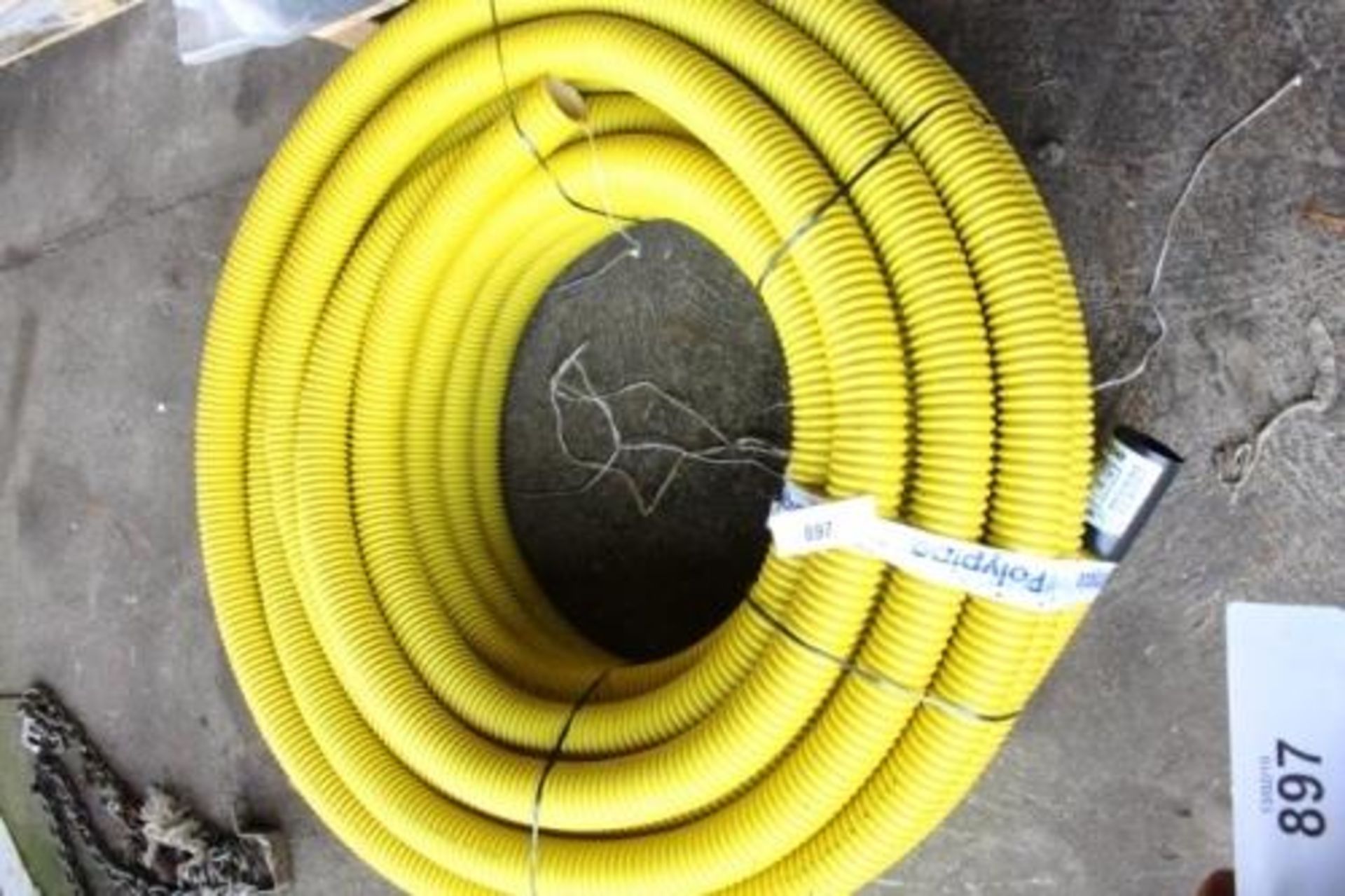 A roll of rigidcoil, 1 yellow poly pipe reference number RC63X5Y, diameter 63cm, internal diameter