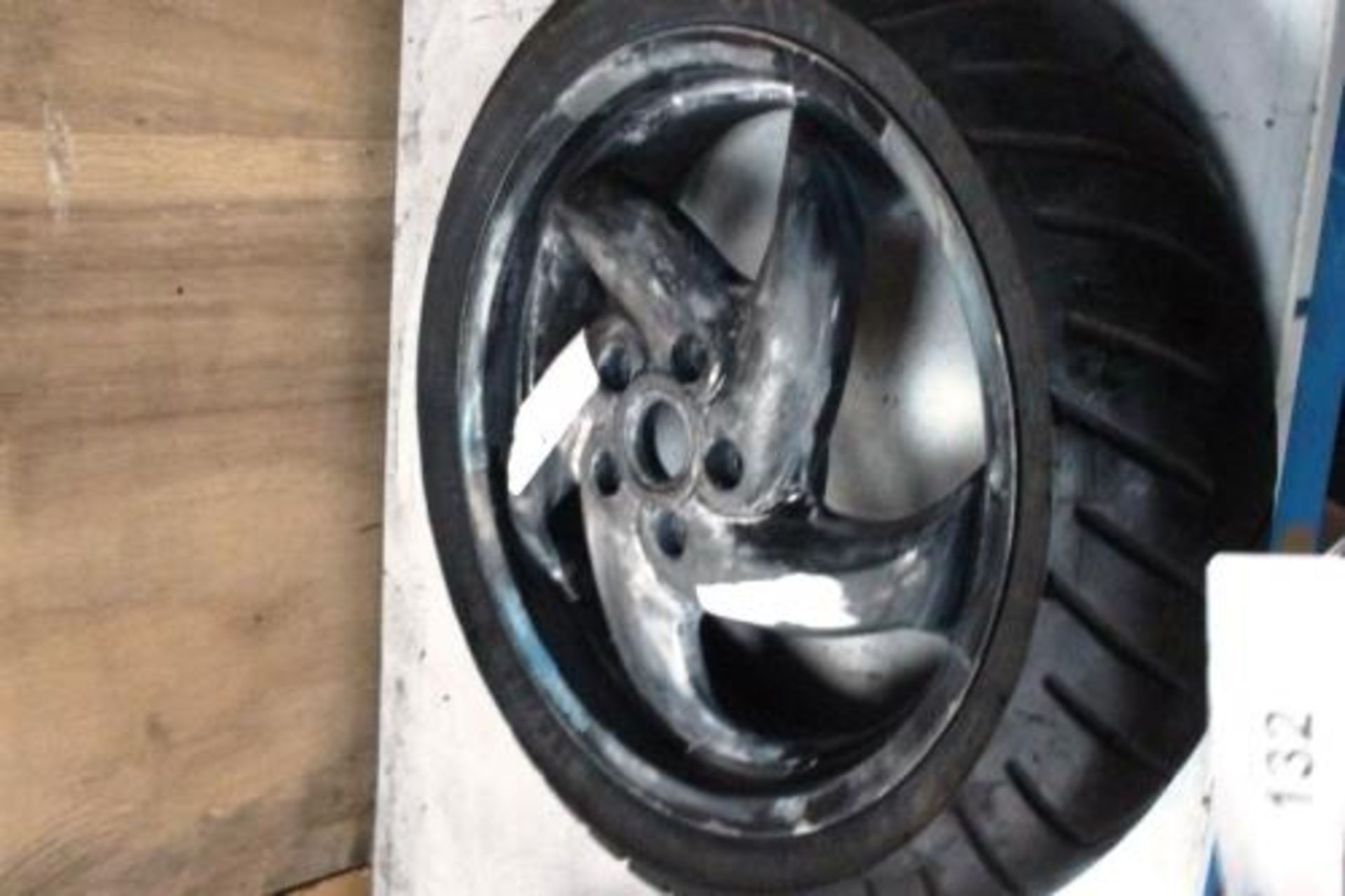A used black moped alloy wheel and Pirelli SL26 tyre, size 130/60-13, needs refurbishing - Used (