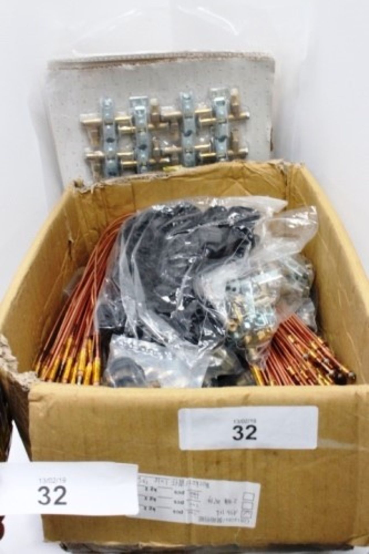 A lot of cooker spare parts including 50 x gas valves and igniters, 50 x 'L' shaped gas couplers