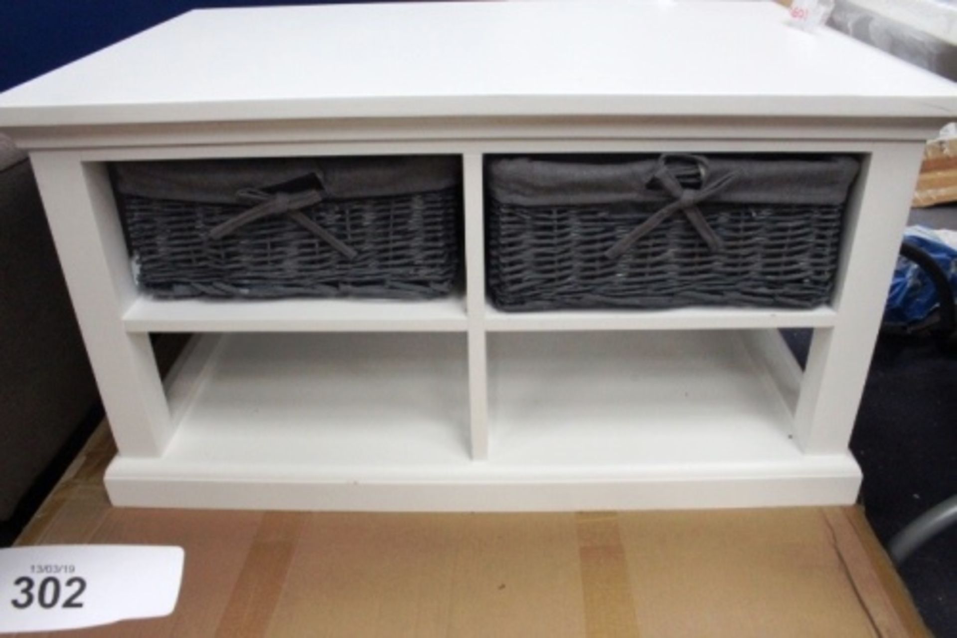 A white coloured coffee table with 4 hole storage and wicker drawers, 890mm x 590mm x 460mm(H) - New
