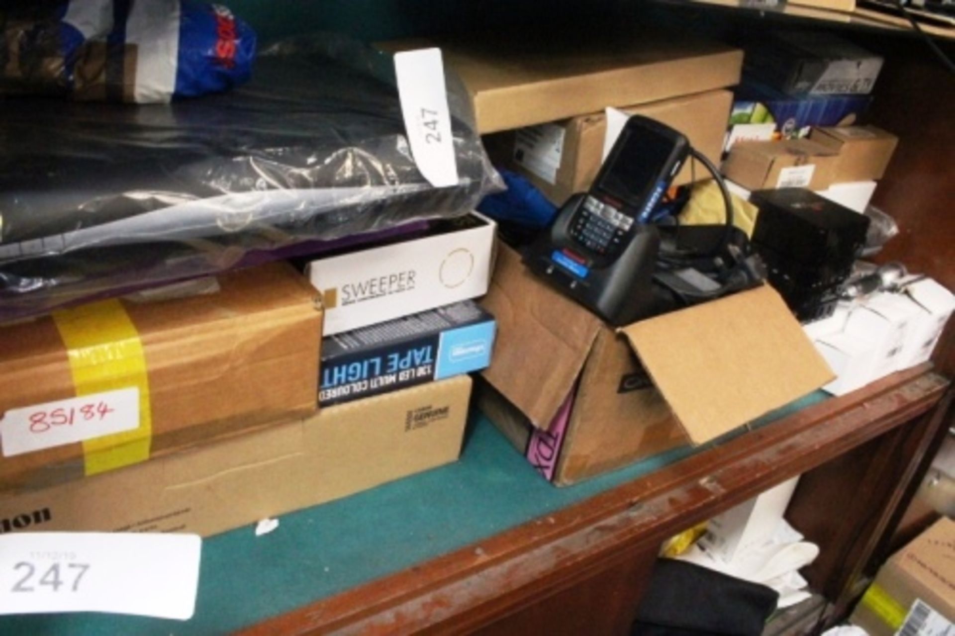 A mixed electrical lot including toner cartridges, Mx Pro TV boxes, thermal printers, hearing tubes,