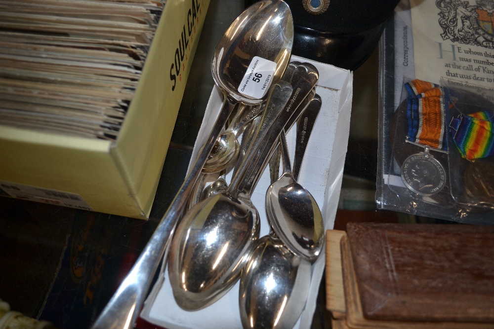 A large silver plated serving spoon; and other sil