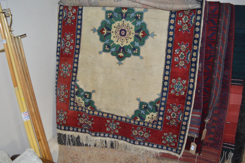 An approx 6" x 4" Eastern patterned rug