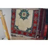 An approx 6" x 4" Eastern patterned rug