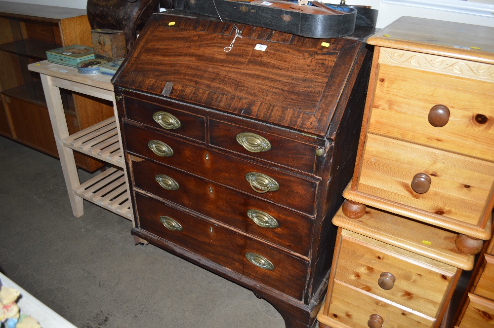 A 19th Century mahogany bureau fitted two short ov