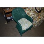 A green painted loom arm chair