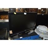 A Toshiba flat screen television with remote contr