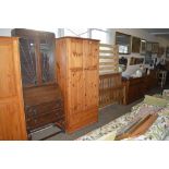 A modern pine double wardrobe fitted single drawer