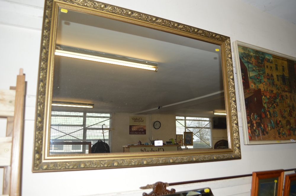 A large gilt framed mirror