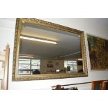 A large gilt framed mirror