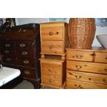 A pair of modern pine bedside chests each fitted t