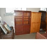 A hardwood bookcase with sliding glass doors